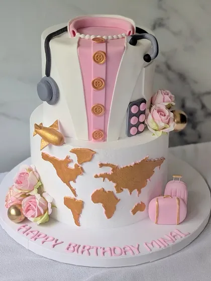 This cake was designed to celebrate two of Minal's passions: her profession as a doctor and her love for travel. The top tier features a detailed doctor's coat and stethoscope, while the bottom tier showcases a world map, telling a unique story of her life's journey.