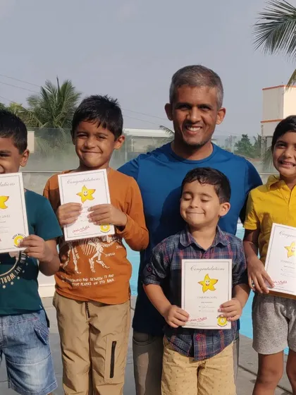 Another group of happy swimmers with their completion certificates. Each one represents a new level of skill and confidence gained in the water.