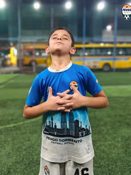 A moment of quiet confidence from a young player celebrating after training.