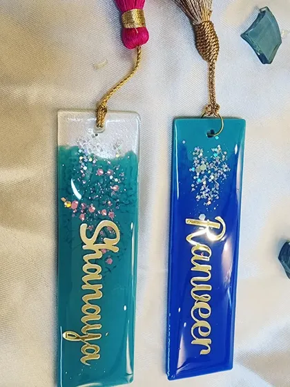 Personalized bookmarks for a cute client. These are made with beautiful shades of blue and teal, with custom names in gold.