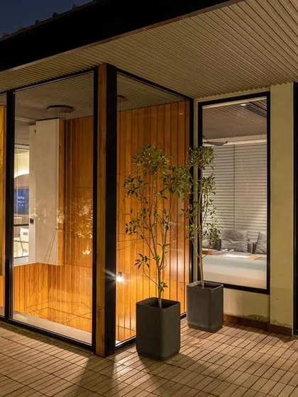 We designed this executive suite in Delhi to be a true retreat. The private bedroom opens directly onto a lush terrace garden, creating a seamless transition between work, rest, and nature. The space is designed for serenity and indulgence, especially during quiet evenings.