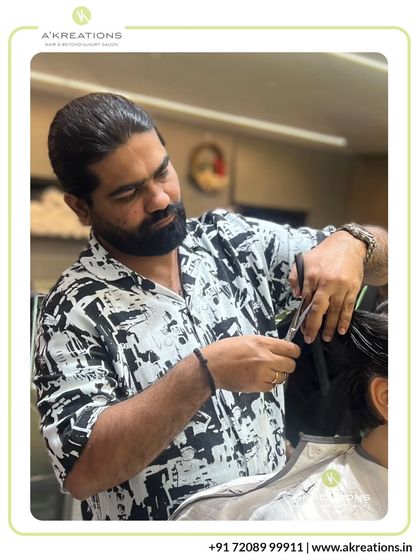 Our Creative Art Director Ram Gore focuses intently on creating clean lines and perfect shape during a haircutting session.