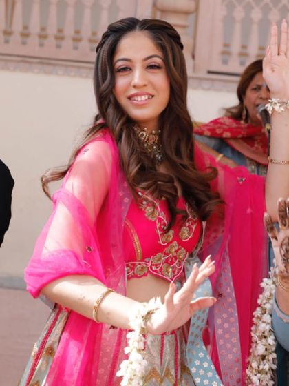 Dancing with joy at her mehendi ceremony. My makeup is designed to last through all the fun and celebrations, so you can enjoy your day without any worries.