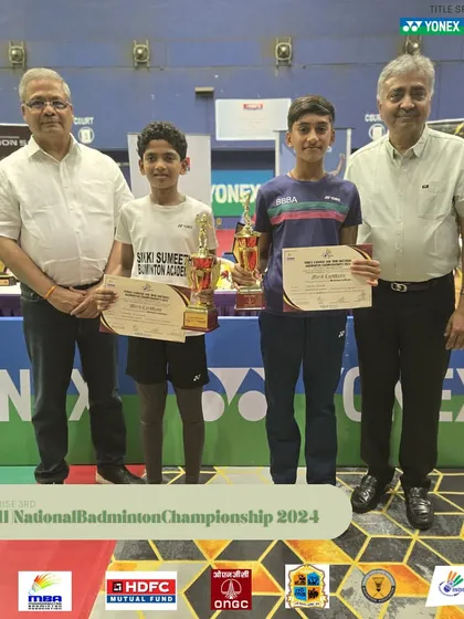 More young champions being honored at the Mini National Badminton Championship prize distribution ceremony.