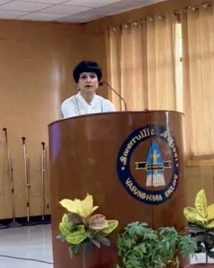 Addressing the teachers from the podium. It's an honor to be invited to speak and share my experience.