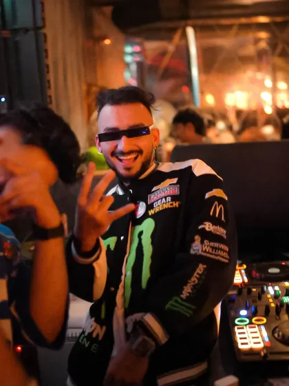 Rocking a motorsport jacket at a New Year's event. My fashion is part of the performance.