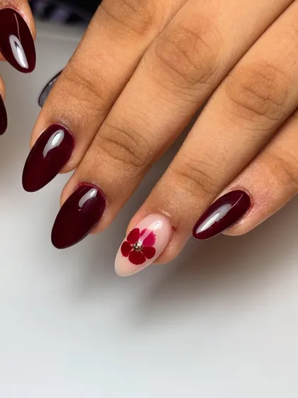 Another view of the berry bliss manicure, showing the beautiful contrast between the deep red and the delicate flower accent nail.