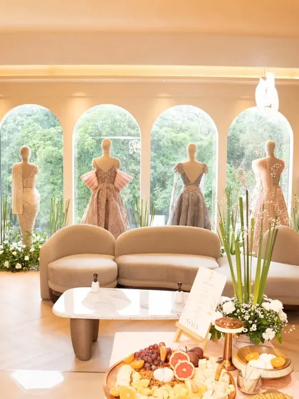 A wide shot of the GAIA boutique launch, where my grazing table became a central part of the beautiful showroom, surrounded by couture and lush greenery.