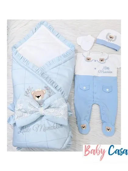 Another view of the "Little Munchkin" set, showing the wrap and romper side by side. The quilted wrap with a large bow perfectly complements the adorable teddy bear romper.
