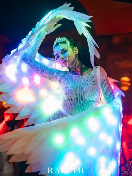 A graceful dance pose from our LED Angel show. The flowing motion of the wings creates a beautiful trail of light, adding a magical quality to the performance.