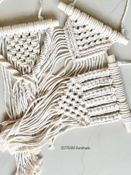 This is a set of three mini macrame wall hangings. They look great grouped together on a wall and are a perfect gift for someone moving into a new home.