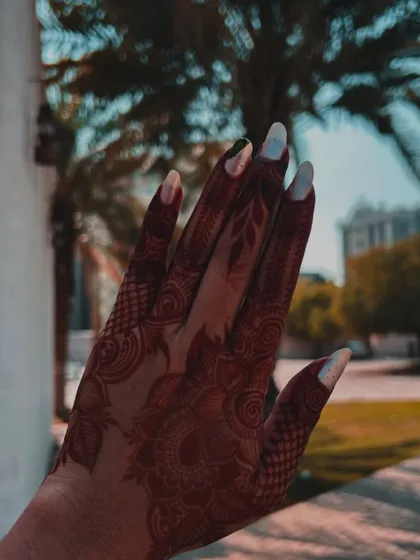 A stunning, fully developed dark maroon henna stain, photographed in natural light. This is the beautiful final result you can achieve with my organic henna and proper aftercare.