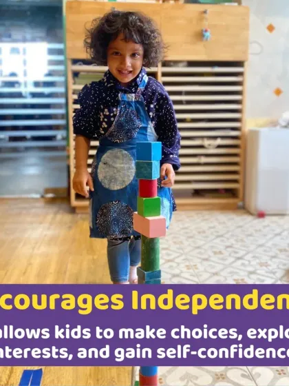 A young girl proudly stands by the tall tower she built. Activities like block building encourage independence, problem-solving, and give a great sense of accomplishment.