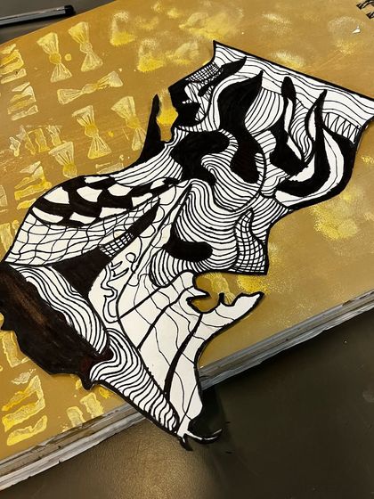 A finished monochromatic piece, showcasing a beautiful balance of positive and negative space and a variety of hand-drawn patterns.