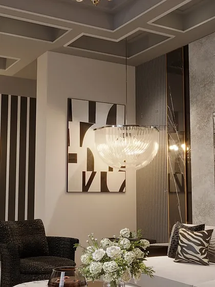 We transformed this basement into a stylish living space with a sleek black and grey theme. Coffered ceilings add depth and dimension, while strategically placed mirrors and a piano nook make it the perfect blend of modern elegance and comfort.