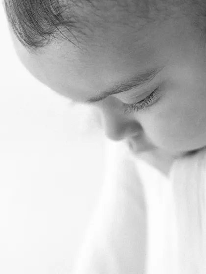 I believe beauty lies in the tiny details. A close up of long eyelashes, the curve of a cheek, the soft hair on their head. These are the details we never want to forget, captured forever in a quiet, artistic portrait.