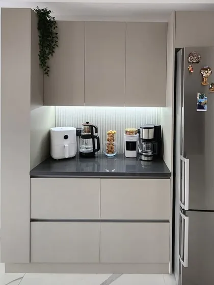 A straight-on shot of the coffee and appliance station. This dedicated space helps keep the main kitchen counters free while providing a convenient spot for daily-use items.