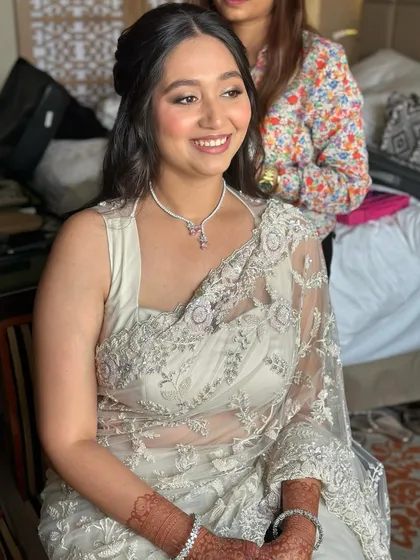 A happy, smiling bride at her Roka. The makeup is light and fresh, perfect for this special pre-wedding celebration.
