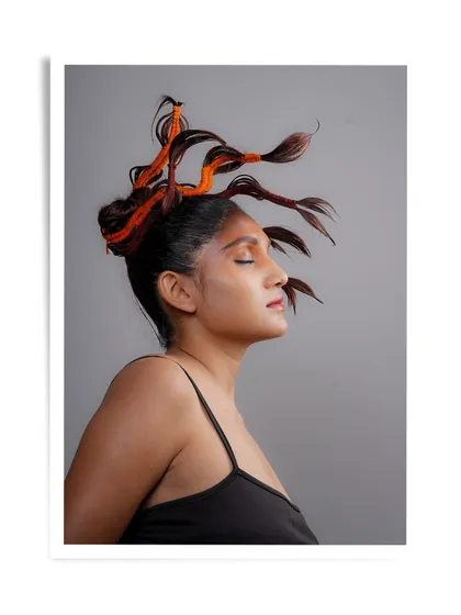 Another view of the tree-inspired hairstyle, showing the intricate work and artistic vision involved.