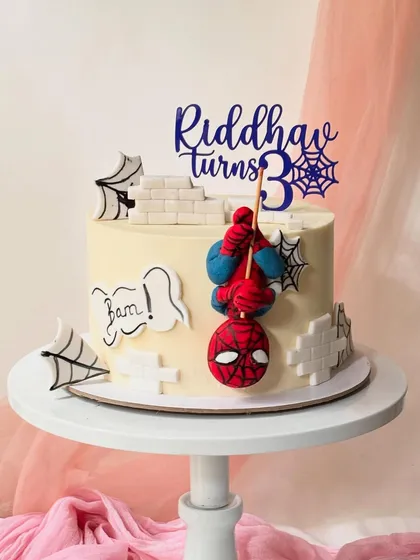 Your friendly neighbourhood Spider-Man swings into action on this custom birthday cake. I used a smooth buttercream base and added fondant details like the brick wall, spiderwebs, and a 3D sculpted Spidey figure for a dynamic, action-packed design.