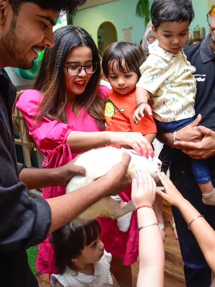 The magic show often includes a furry friend! The kids are always so gentle and curious when the rabbit makes an appearance.