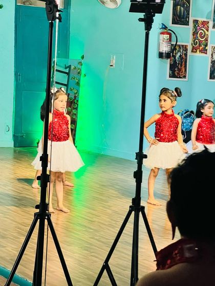 Behind the scenes of a recent shoot. We use professional lighting to capture our students' performances, making them feel like the stars they are.