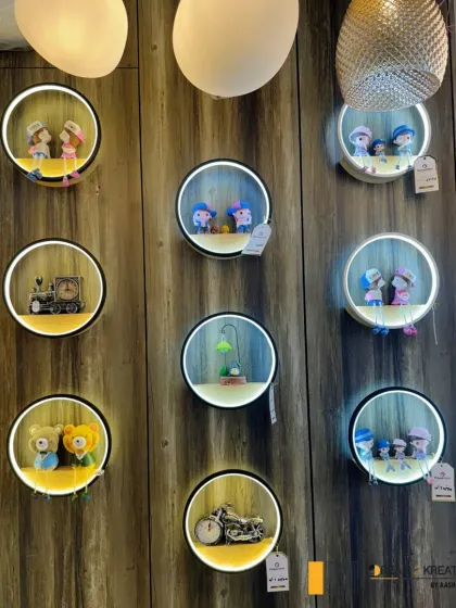 A collection of charming, illuminated wall decor pieces I spotted. These whimsical lights are perfect for adding a playful and personal touch to a child's room or a quirky corner of a home.