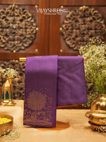 A magnificent purple Kanjivaram with a "Tree of Life" pallu, a narrative piece showcasing incredible craftsmanship.