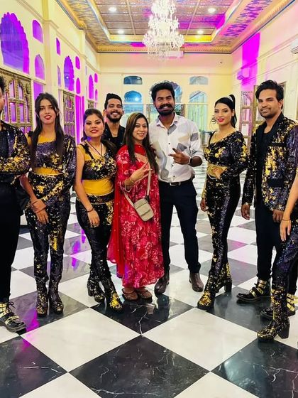 Posing with our amazing dance troupe. Their professionalism and talent allow us to execute even the most complex choreographies flawlessly.