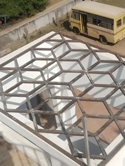 The structural metal frame for a skylight with a 3D cube pattern, shown here before the glass or panels are installed. This highlights the strong, geometric foundation of our custom skylight designs.