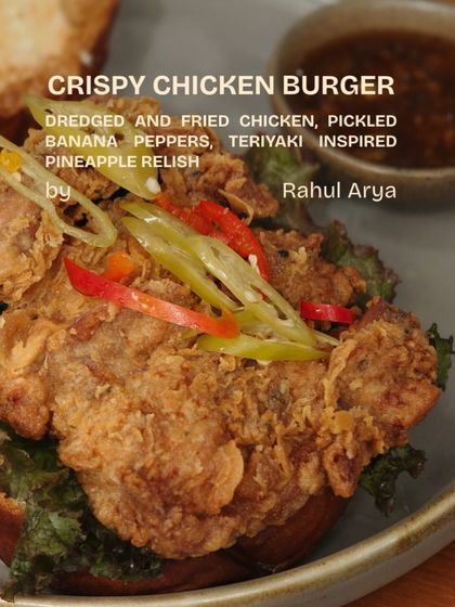 Chef Rahul Arya's take on a Crispy Chicken Burger, with pickled banana peppers and a teriyaki-inspired pineapple relish.