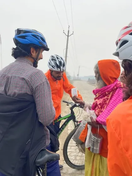 A moment of connection on the road. During our Krishna's Trails tour, we often stop to chat with locals, like this sadhu, sharing a moment of our day. It's these small interactions that create the biggest memories.