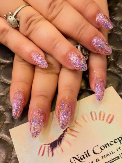 Full-on glamour with these almond-shaped nails completely covered in holographic pink glitter. Perfect for anyone who loves to sparkle.