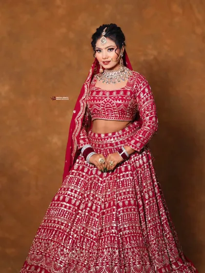 A confident pose from a stunning bride. The makeup is bold yet elegant, designed to empower you on your wedding day.