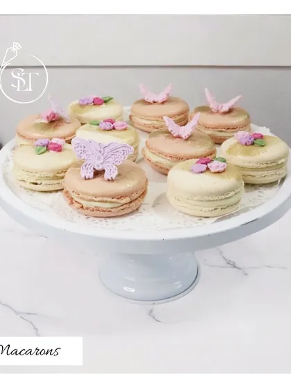 Our delicate and elegant French Macarons are perfect for dessert tables or as a sophisticated gift. These are decorated with tiny sugar butterflies and flowers, showcasing our attention to detail.
