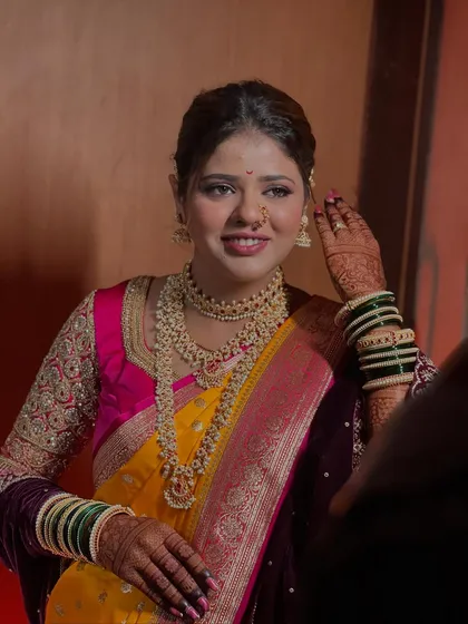 A candid moment with my beautiful bride, showcasing her radiant smile and traditional Maharashtrian jewellery, including the classic nath and layered necklaces.