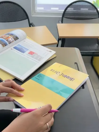 A glimpse of our custom-designed "IFLAC Junior" workbook. We create our own materials to ensure the learning experience is simple, engaging, and perfectly suited for our students.