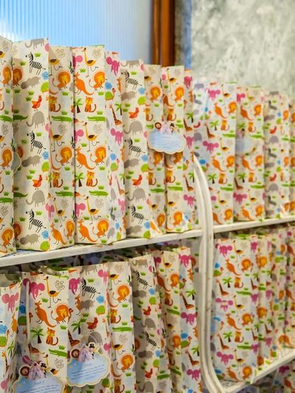 Adorable animal-print goodie bags filled with treats and toys for the little guests.