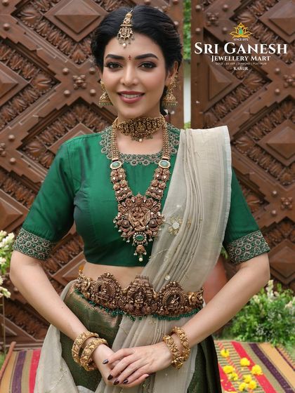 Another angle from the bridal jewellery shoot, highlighting the full set of traditional gold ornaments. The makeup features a soft, glowing base and defined eyes, ensuring the focus remains on the exquisite craftsmanship of the jewellery.