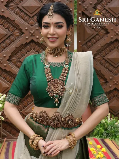 Another angle from the bridal jewellery shoot, highlighting the full set of traditional gold ornaments. The makeup features a soft, glowing base and defined eyes, ensuring the focus remains on the exquisite craftsmanship of the jewellery.