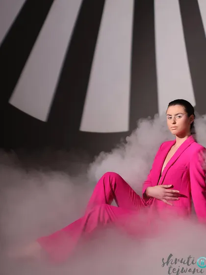 A powerful seated pose amidst the smoke, with dramatic lighting creating a strong contrast. This kind of imagery is perfect for a brand looking to make a bold statement.