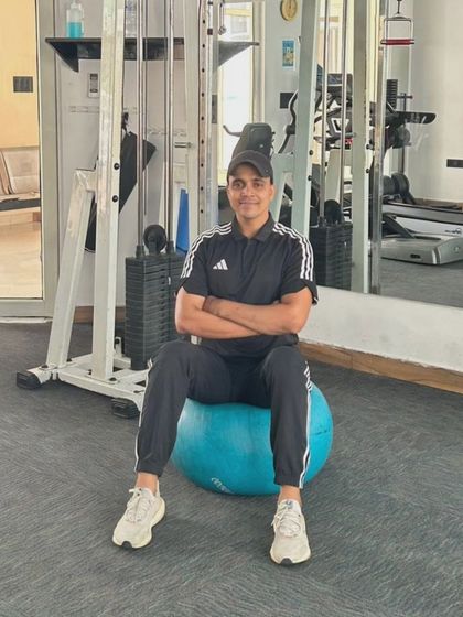 Seated on a stability ball, a simple yet effective way to engage core muscles throughout a session.