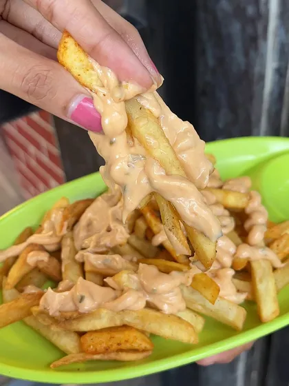 A bite of my Thousand Island Fries, showing the creamy and tangy dressing that makes them so special.