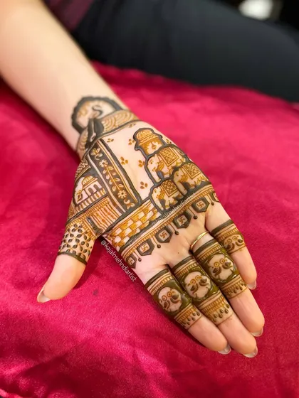 The design with the henna paste still on, showing the texture.