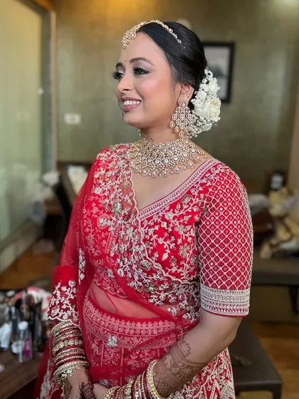 Another shot of the happy bride, her classic hairstyle looking flawless.