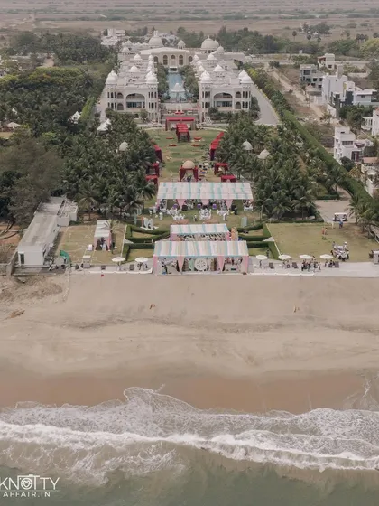 Drone photography allows me to capture the grand scale of your celebration. This aerial view of a stunning beachside resort in Chennai shows not just the venue, but the entire world you've created for your special day.