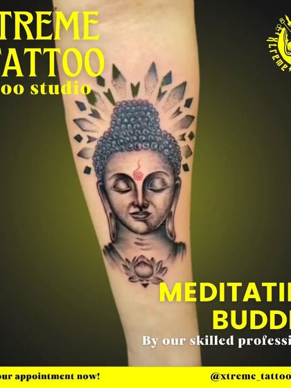 A serene meditating Buddha tattoo on the forearm. This design is meant to inspire peace and mindfulness, with a halo of crystals representing enlightenment.