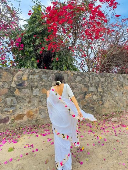 A back shot showing the beautiful floral border and the low-back blouse. The movement of the lightweight mul cotton fabric is just so graceful.