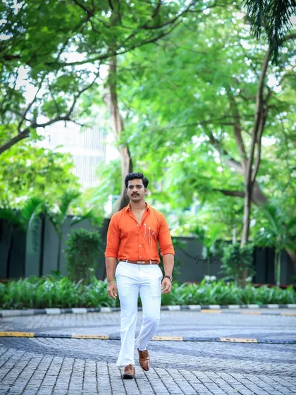A dynamic walking shot of Rohit Parshuram, capturing his confident stride and impeccable styling.