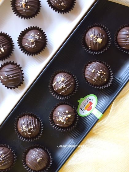 A close-up of my homemade chocolate truffles. These are filled with a smooth ganache and topped with crushed nuts, making them a rich and satisfying treat.